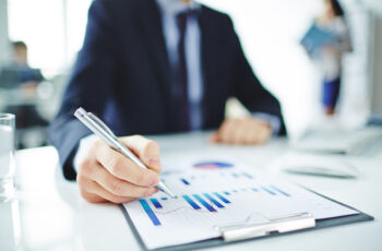 Businessman working with data in document